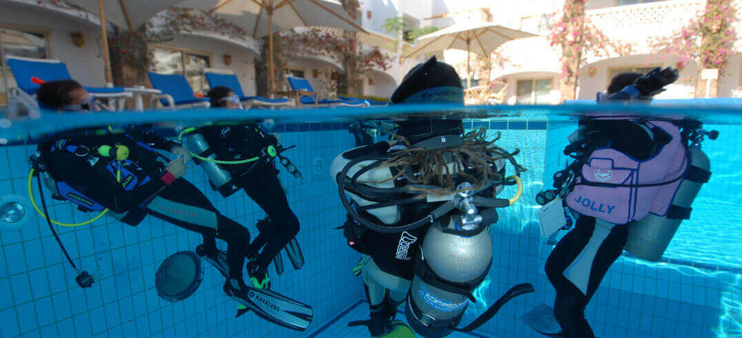 Assistant Instructor Course - divers on the surface of our pool - above and below shot