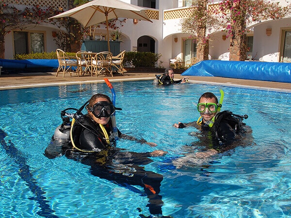 two divers training in the Camel Dive Club pool
